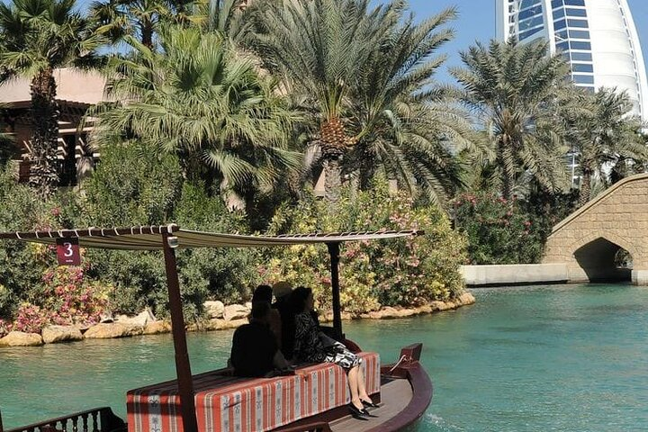 Drift along tranquil waterways surrounded by lush greenery and stunning architecture as you uncover the hidden gems of the Souk Madinat Jumeirah blending tradition with unique shopping experiences.